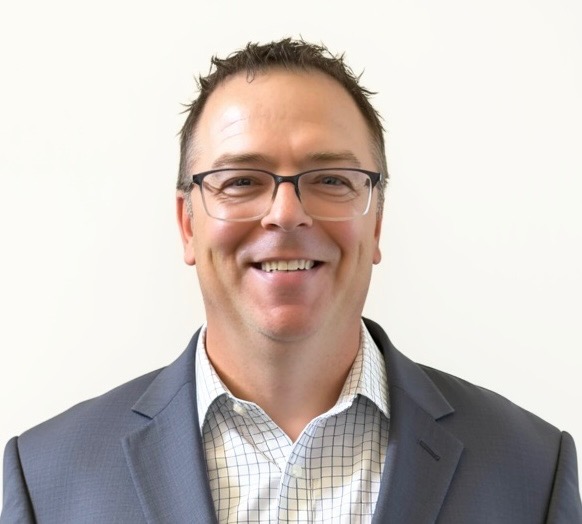 A headshot of Troy Markusson, Head of Global Payroll, CoreWeave
