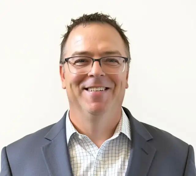 A headshot of Troy Markusson, Head of Global Payroll, CoreWeave